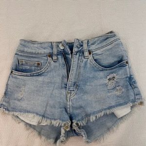 Ripped denim shorts by divided. Size small.